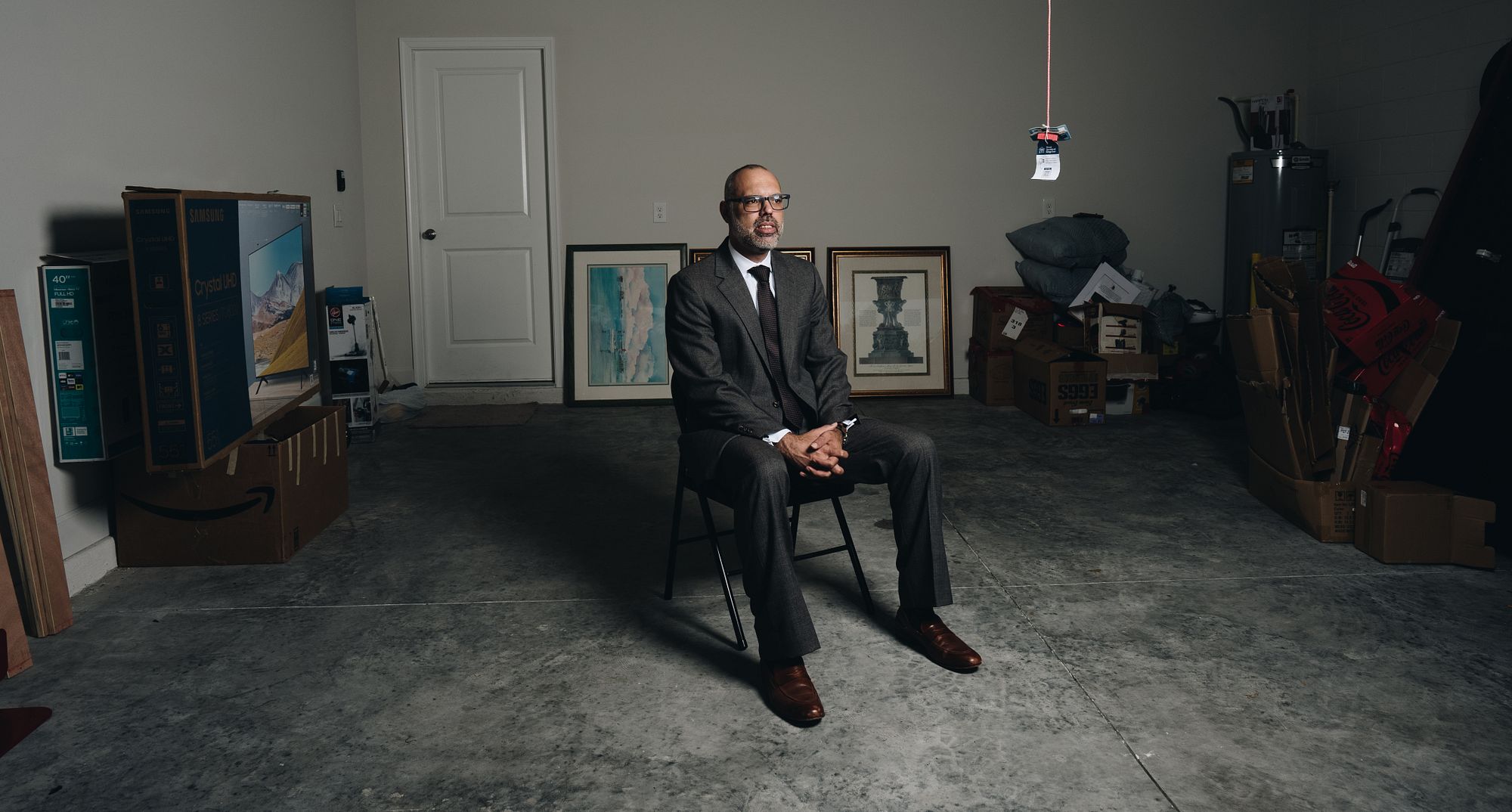 Allan Dos Santos seated alone in a room
